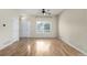 Sunlit living room featuring hardwood floors and a large window at 19240 E Carolina Dr # 104, Aurora, CO 80017