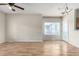 Bright living room with hardwood floors and a large window offering natural light at 19240 E Carolina Dr # 104, Aurora, CO 80017