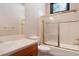 Bright bathroom featuring tiled walls, shower and tub combination, and a wood vanity with a sink at 160 N Fuller Placer Rd, Breckenridge, CO 80424