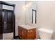 Bathroom featuring a wood vanity with a sink, neutral walls, and a dark wood door frame at 160 N Fuller Placer Rd, Breckenridge, CO 80424