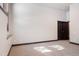 Bedroom with neutral carpet, neutral walls, and a dark wood door frame leading to another room at 160 N Fuller Placer Rd, Breckenridge, CO 80424