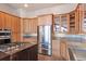 Modern kitchen features stainless steel appliances, granite countertops, and custom wood cabinets at 160 N Fuller Placer Rd, Breckenridge, CO 80424