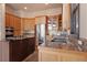 Well-lit kitchen featuring granite countertops, stainless steel appliances, and ample cabinet space at 160 N Fuller Placer Rd, Breckenridge, CO 80424