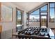 Island gas cooktop highlighted by vaulted ceilings, large scenic windows, and mountain views at 160 N Fuller Placer Rd, Breckenridge, CO 80424