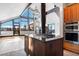 Open-concept kitchen features an island gas cooktop, vaulted ceilings, and mountain view windows at 160 N Fuller Placer Rd, Breckenridge, CO 80424