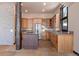 Well-lit kitchen featuring granite countertops, stainless steel appliances, and ample cabinet space at 160 N Fuller Placer Rd, Breckenridge, CO 80424