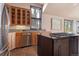 Well-lit kitchen boasts stainless appliances, granite counters, a gas cooktop island, and gorgeous window views at 160 N Fuller Placer Rd, Breckenridge, CO 80424