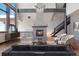 Cozy living room featuring a stone fireplace, hardwood floors, and stylish decor at 160 N Fuller Placer Rd, Breckenridge, CO 80424
