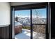 A close-up scenic mountain view with bare tree from an indoor balcony at 160 N Fuller Placer Rd, Breckenridge, CO 80424