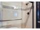 Bathroom shower featuring decorative tile, a shower head, and a glass door at 160 N Fuller Placer Rd, Breckenridge, CO 80424