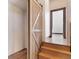 An interior staircase with a custom sliding barn door at 160 N Fuller Placer Rd, Breckenridge, CO 80424