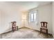 Spare bedroom with neutral carpet and light walls with a window at 3803 Dyanna Dr, Thornton, CO 80241