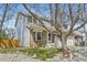 Charming two-story home featuring a brick and gray siding, a well-manicured lawn, and a two car garage at 3803 Dyanna Dr, Thornton, CO 80241