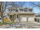 Charming two-story home with a brick facade, dormer windows and a two car garage at 3803 Dyanna Dr, Thornton, CO 80241