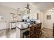Bright kitchen featuring stainless steel appliances, bar seating, and an open layout at 3803 Dyanna Dr, Thornton, CO 80241