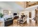 Spacious living room with hardwood floors, comfortable seating, and a warm, inviting atmosphere at 3803 Dyanna Dr, Thornton, CO 80241