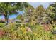 Beautiful community park with vibrant flowers, lush trees, and inviting gazebo at 3803 Dyanna Dr, Thornton, CO 80241