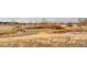 Scenic park view showcasing a gravel path, lake, benches, and a picturesque landscape at 3803 Dyanna Dr, Thornton, CO 80241