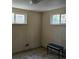 Bedroom with carpet, two windows, and small bench at 3841 Myers Gulch Rd, Kittredge, CO 80457