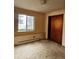 Bedroom with closet and window, carpeted, ready for personalization and design at 3841 Myers Gulch Rd, Kittredge, CO 80457