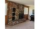 Living room brick fireplace and wood walls at 3841 Myers Gulch Rd, Kittredge, CO 80457