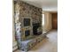 Close-up of a living room stone fireplace at 3841 Myers Gulch Rd, Kittredge, CO 80457