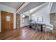 Elegant dining room with high ceilings, hardwood floors, and modern chandelier at 2049 Silverheels Dr, Larkspur, CO 80118