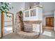 Unique foyer featuring a stone water feature with a view of the second floor at 2049 Silverheels Dr, Larkspur, CO 80118
