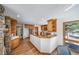 Well-lit kitchen with wooden cabinets and a functional layout, ideal for cooking at 2049 Silverheels Dr, Larkspur, CO 80118
