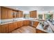 Spacious kitchen with wooden cabinets, stainless steel appliances, and ample counter space at 2049 Silverheels Dr, Larkspur, CO 80118