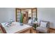 Comfortable home office with french doors, natural light, and hardwood floors at 2049 Silverheels Dr, Larkspur, CO 80118