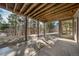 Covered patio with views of trees at 2049 Silverheels Dr, Larkspur, CO 80118