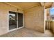 Private balcony with sliding glass door, showcasing textured walls and a view of surrounding greenery at 3035 Oneal Pkwy # 20V, Boulder, CO 80301