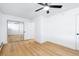 Bedroom with hardwood floors and a mirrored closet at 3035 Oneal Pkwy # 20V, Boulder, CO 80301