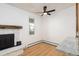 Cozy living room showcases hardwood floors, a stone fireplace, and plenty of natural light at 3035 Oneal Pkwy # 20V, Boulder, CO 80301