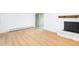 The living room features hardwood floors and a white brick fireplace at 3035 Oneal Pkwy # 20V, Boulder, CO 80301