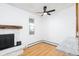 Living room showcasing the fireplace and a ceiling fan at 3035 Oneal Pkwy # 20V, Boulder, CO 80301