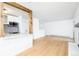 A spacious living room with hardwood floors next to the updated kitchen at 3035 Oneal Pkwy # 20V, Boulder, CO 80301