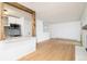 Bright living room featuring hardwood floors and an open floor plan connected to the kitchen at 3035 Oneal Pkwy # 20V, Boulder, CO 80301
