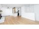 Open living space with hardwood floors, fireplace, and a view of the kitchen at 3035 Oneal Pkwy # 20V, Boulder, CO 80301