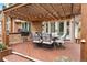 Covered deck with outdoor kitchen and dining area, perfect for entertaining guests in a stylish setting at 7703 S Grape Ct, Centennial, CO 80122