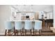 Bright, updated kitchen featuring white cabinetry, quartz countertops, pendant lighting, and stainless steel appliances at 7703 S Grape Ct, Centennial, CO 80122