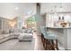 Open-concept living space featuring a modern kitchen and a comfortable living room with a skylight at 7703 S Grape Ct, Centennial, CO 80122
