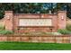 Stone sign welcomes you to Heritage Greens with colorful flowers and green lawn at 7703 S Grape Ct, Centennial, CO 80122