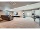 Spacious finished basement offering a rec room and home gym area for leisure and exercise at 10178 Nadine Ave, Parker, CO 80134