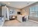 A serene bedroom features a desk, a comfortable chair, and a whimsical decorative canopy, creating a cozy and inviting space at 10178 Nadine Ave, Parker, CO 80134