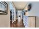 Elegant entryway featuring hardwood floors, stylish decor, and a view into the home at 10178 Nadine Ave, Parker, CO 80134