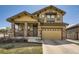 Charming two-story home with stone accents, a covered porch, and a two-car garage at 10178 Nadine Ave, Parker, CO 80134