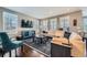 Bright living room with hardwood floors, plantation shutters, and comfortable seating at 10178 Nadine Ave, Parker, CO 80134