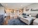 Open-concept living space with sectional seating and a view of the staircase landing at 10178 Nadine Ave, Parker, CO 80134